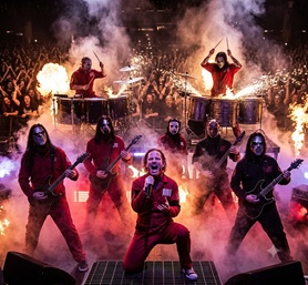 A chaotic heavy metal performance with masked musicians