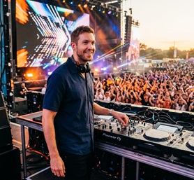 Calvin Harris DJing at a massive outdoor festival
