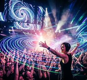 Ethereal blue and purple lasers shooting across a dark club