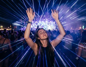 Ethereal blue and purple laser lights in a dark arena