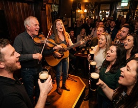 Wooden tables and pints of dark beer in a traditional tavern