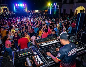 People dancing joyfully to Cumbia rhythms