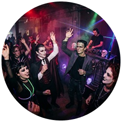 People in scary costumes dancing at a party