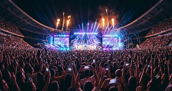 High energy pop concert crowd with glowing chart music icon